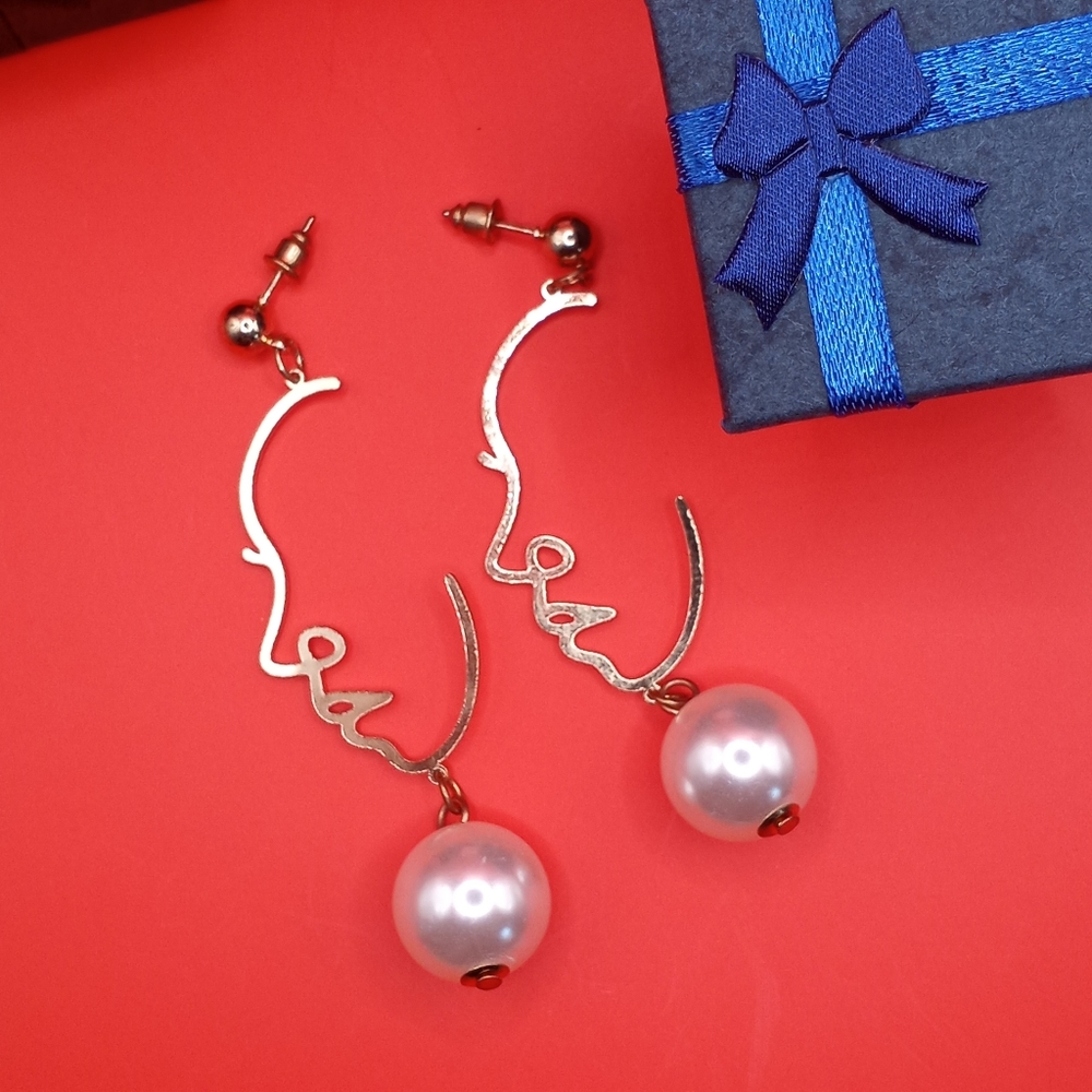 Portrait and Pearl Earrings